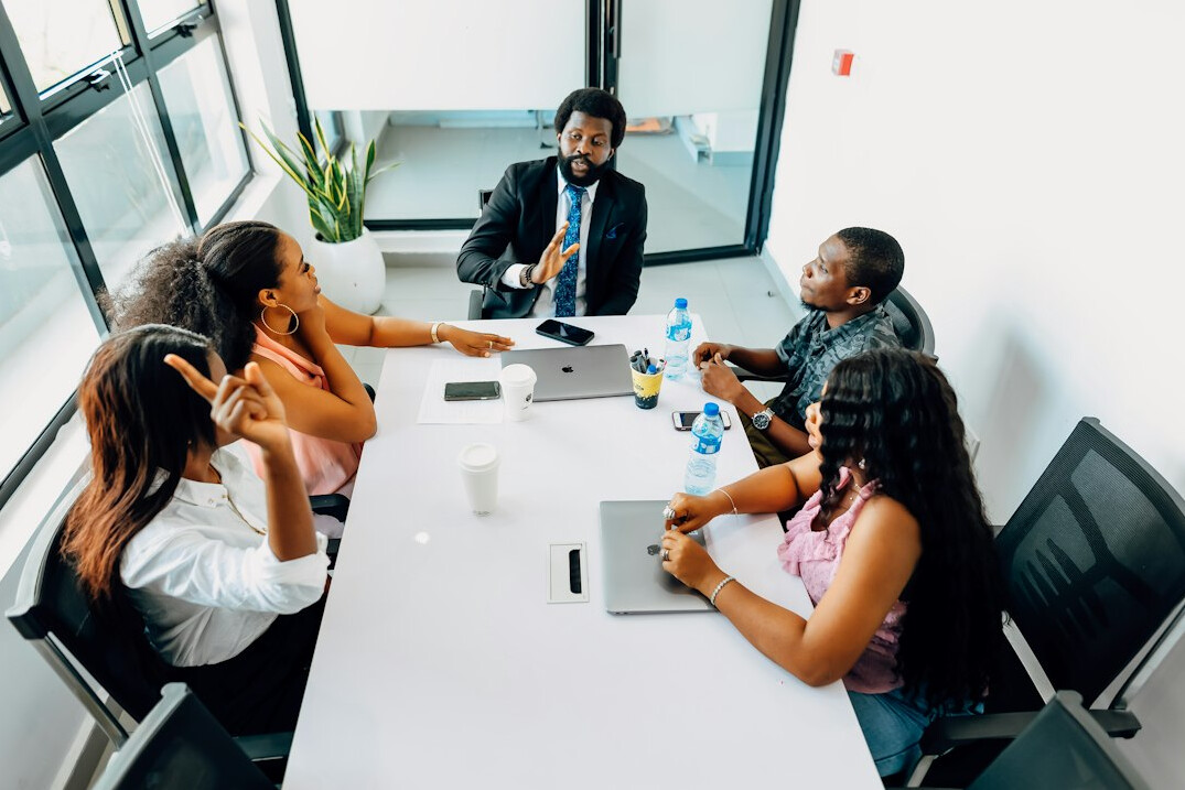 manager leading team meeting